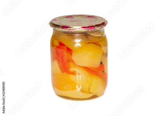 Juicy preserved sweet peppers in a glass jar with metal cap on white background, ecologial homemade pickles photo