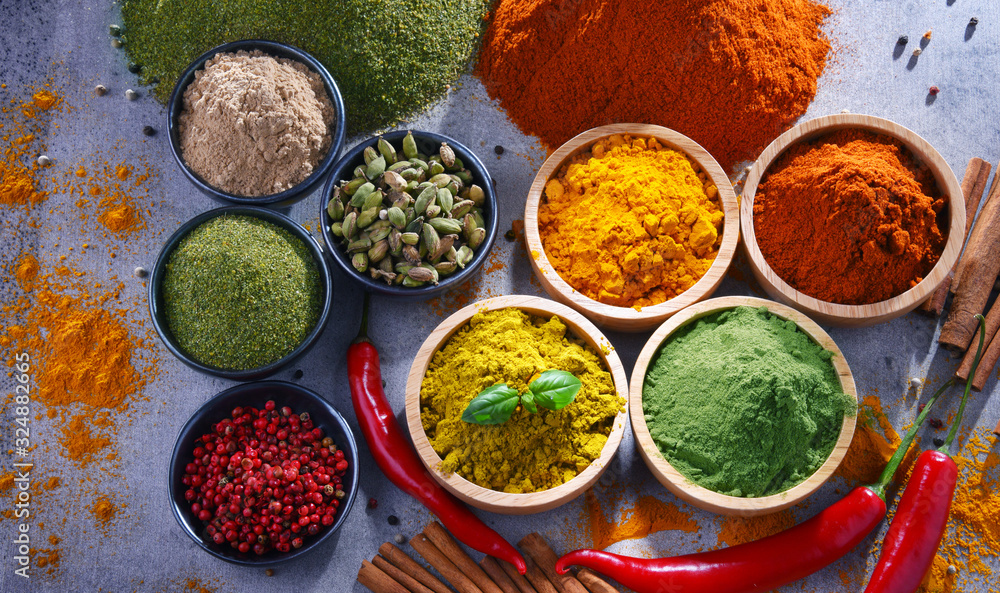 Variety of spices on kitchen table Variety of spices on kitchen table