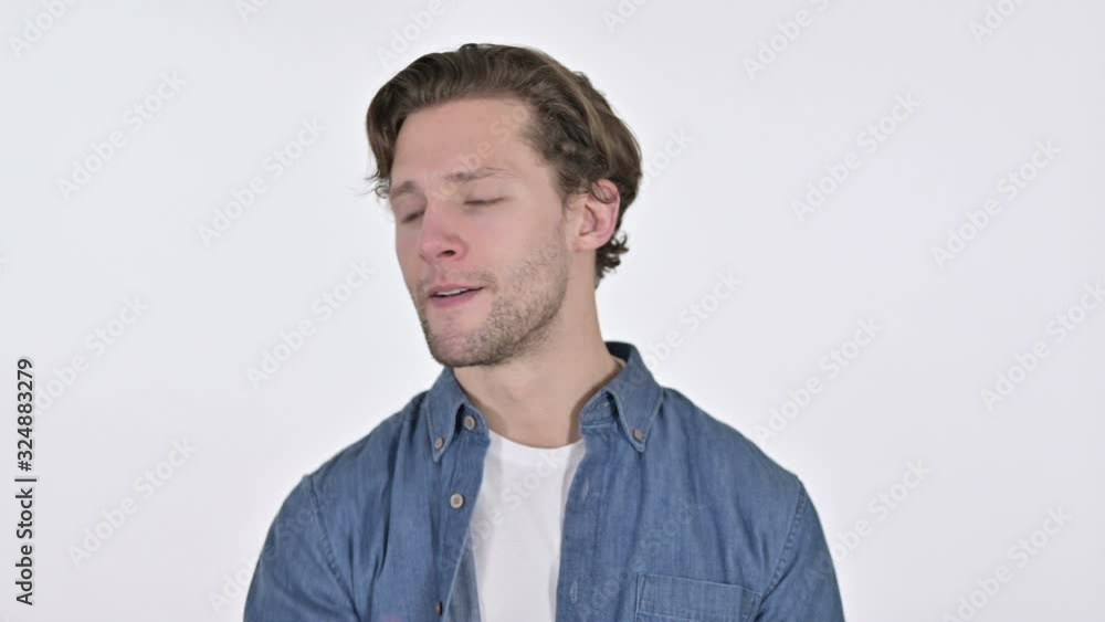 Disappointed Young Man having Loss, Failure Sign on White Background Disappointed Young Man having Loss, Failure Sign on White Background