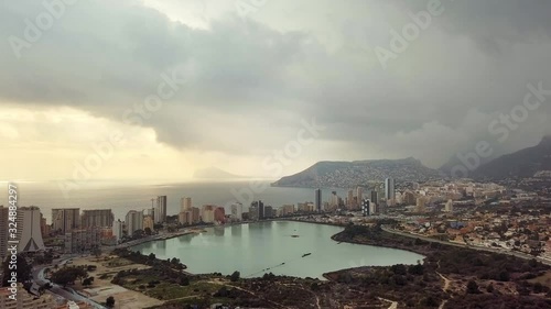 Residential houses in the touristic town of Calp in Alicante Spain. view of the sea, cliffs and mountains, a small bay