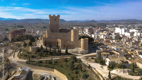 Aerial view of Atalaya castle over Villena Spain. The fortress has concentric plan, with a rectangular barbican forming space in front of the keep.  The external wall has chemin-de-ronde or wall-walk photo