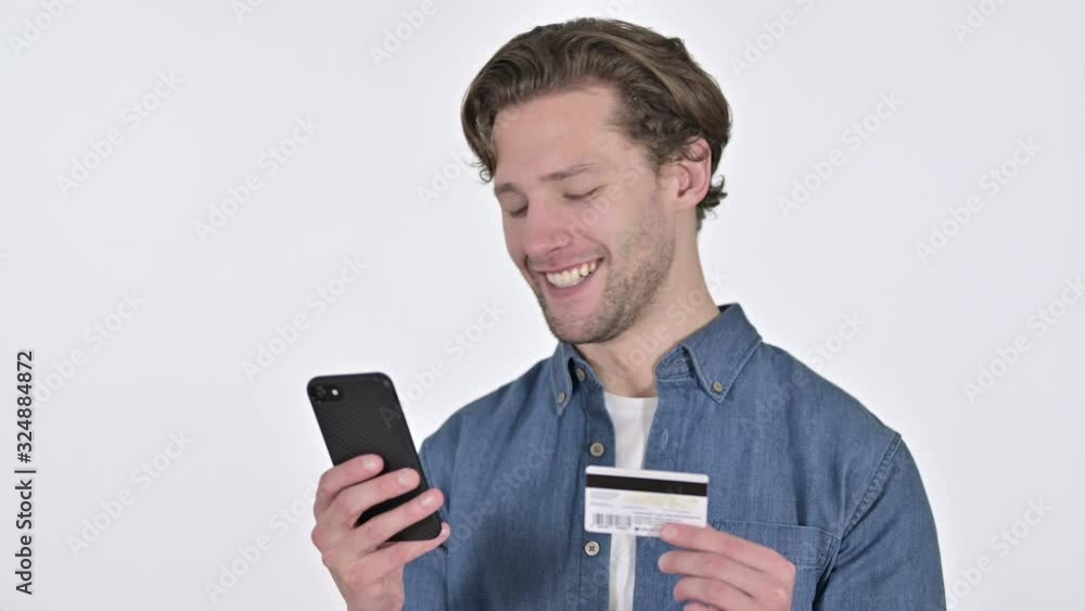 Online Payment on Smartphone by Young Man on White Background Online Payment on Smartphone by Young Man on White Background