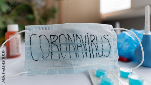 Novel coronavirus - 2019-nCoV. The inscription medical protective mask Coronavirus. Chinese coronavirus outbreak. MERS-Cov middle East respiratory syndrome coronavirus.Protective medicines, pills