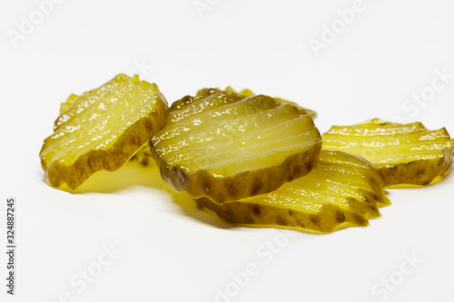 some slices of sandwich cucumber on white background