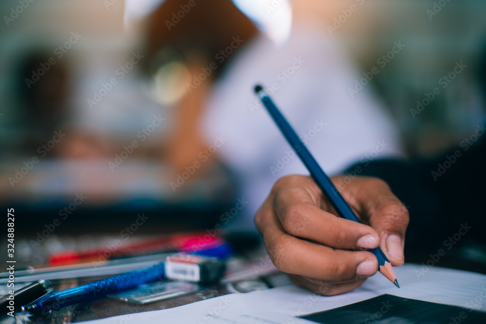 Students writing and reading exam answer sheets exercises in school with stress. Students writing and reading exam answer sheets exercises in school with stress.