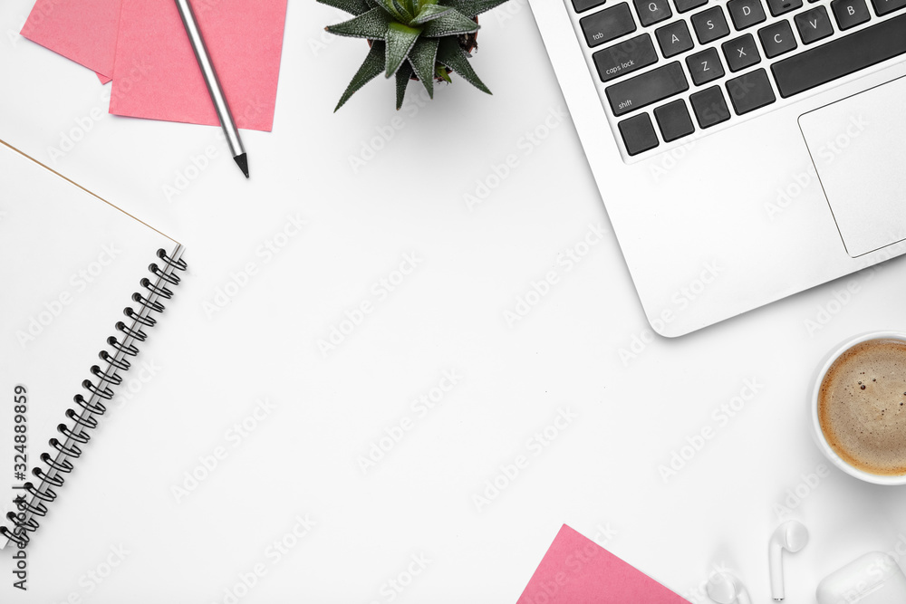 Fototapeta Flat lay mock-up. Feminine home office workspace, copyspace. Inspiring workplace for productivity. Concept of business, fashion, freelance, finance and artwork. Trendy pastel colors. Clear white.