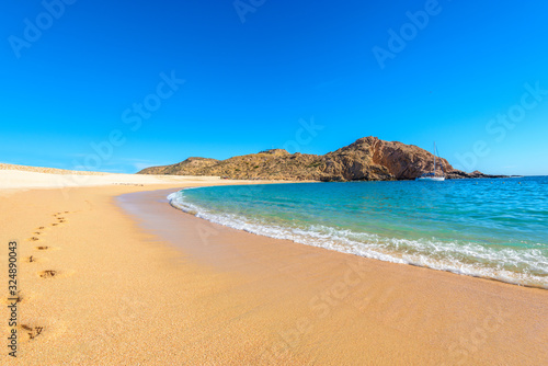 Santa Maria Beach, Cabo San Lucas, Mexico.  Fantastic ocean waves. Rocky and sandy beach. © karamysh