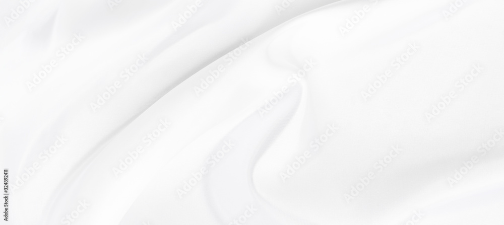 White gray satin texture that is white silver fabric silk panorama background with beautiful soft blur pattern natural.