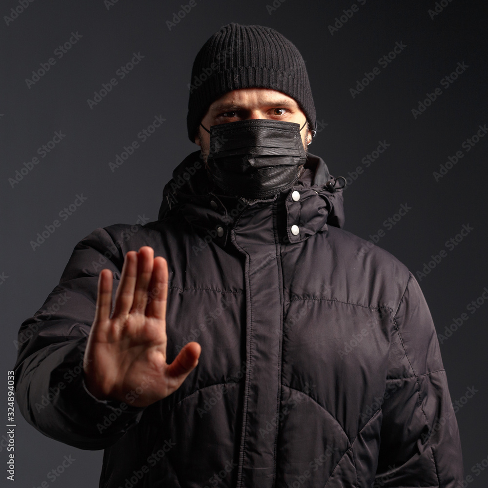 portrait of a young man in a jacket and an antivirus mask portrait of a young man in a jacket and an antivirus mask