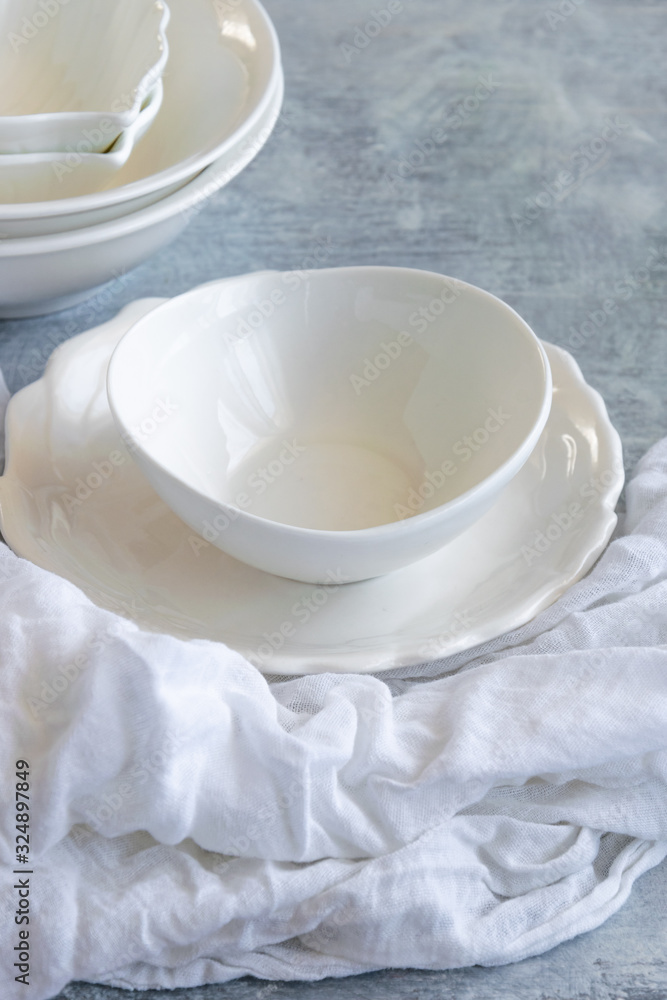 Different white ceramic plates, various tableware Different white ceramic plates, various tableware