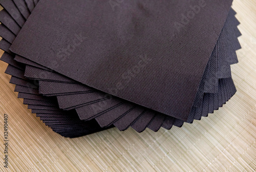 black napkins with wooden background