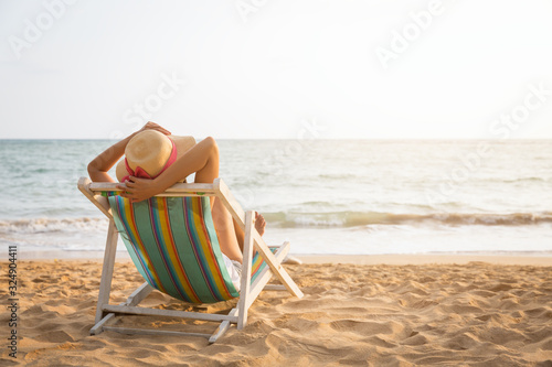 Woman on beach in summer photo