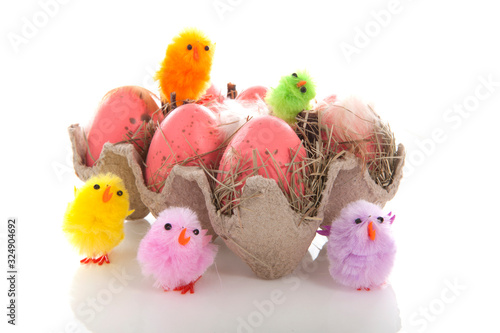 Funny and colorful easter decoration with eggs and chicken over white background