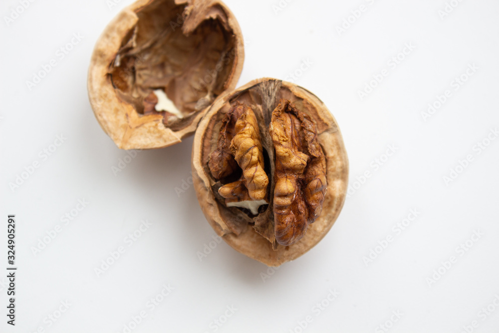 Walnut close - up isolated on a white background. Walnut close - up isolated on a white background.