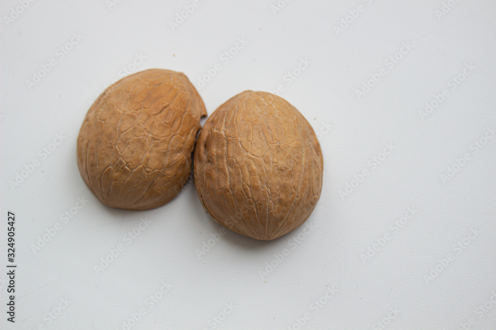 Walnut close - up isolated on a white background. Walnut close - up isolated on a white background.