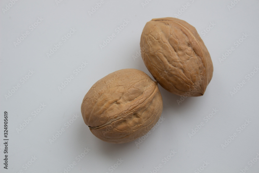 Walnut close - up isolated on a white background. Walnut close - up isolated on a white background.