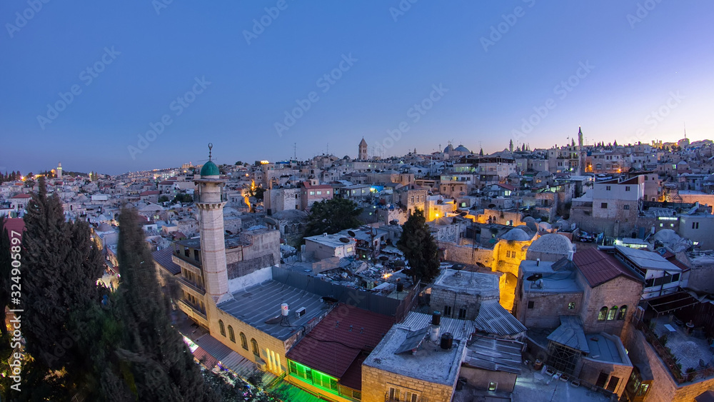 Obraz premium Panorama of Jerusalem Old City day to night timelapse from Austrian Hospice Roof, Israel