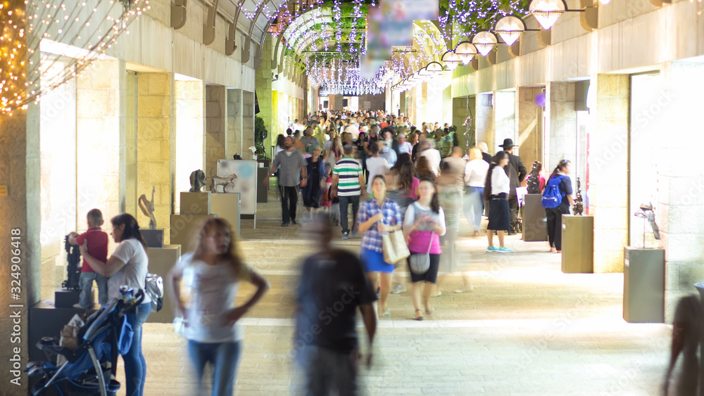 Fototapeta premium Shoppers and tourists at Mamilla shopping street timelapse in Jerusalem.