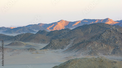 Sunrise on hills in desert