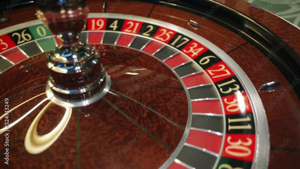 Сasino: roulette in Las Vegas with white ball. The ball falls on the black field thirty five 35. Close-up Сasino: roulette in Las Vegas with white ball. The ball falls on the black field thirty five 35. Close-up