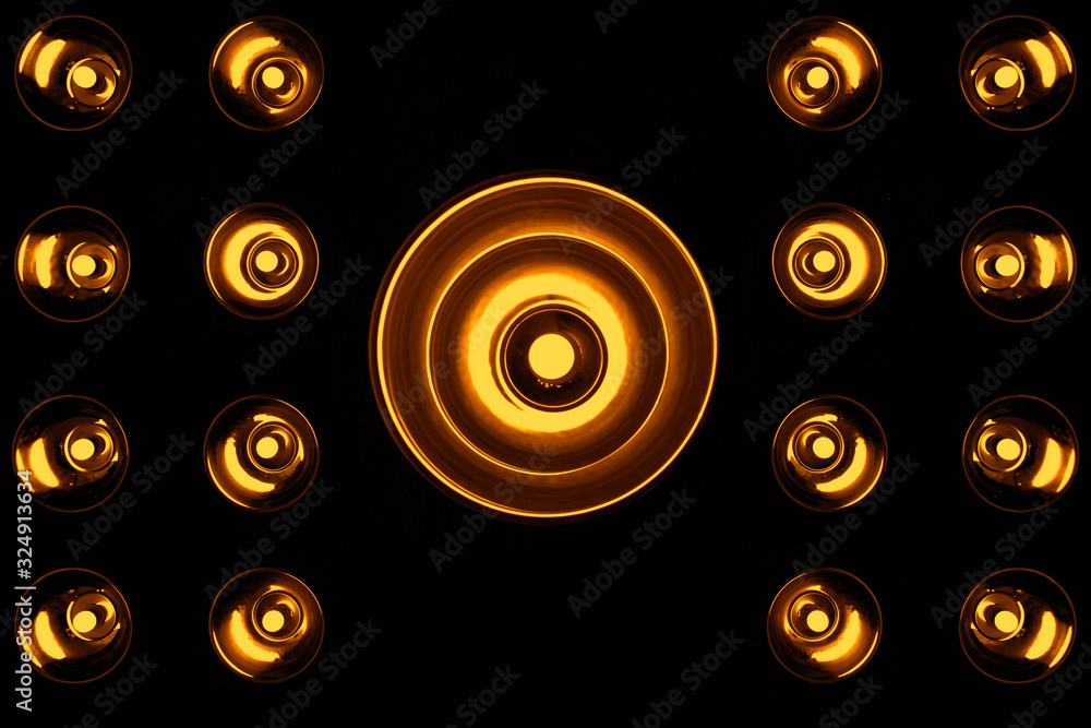 Studio lights in the wall, abstract dark background of the Studio wall and display of your product.Grey empty product show.yellow standard bulb sticking out of the wall.lighting.decorative wall Studio lights in the wall, abstract dark background of the Studio wall and display of your product.Grey empty product show.yellow standard bulb sticking out of the wall.lighting.decorative wall