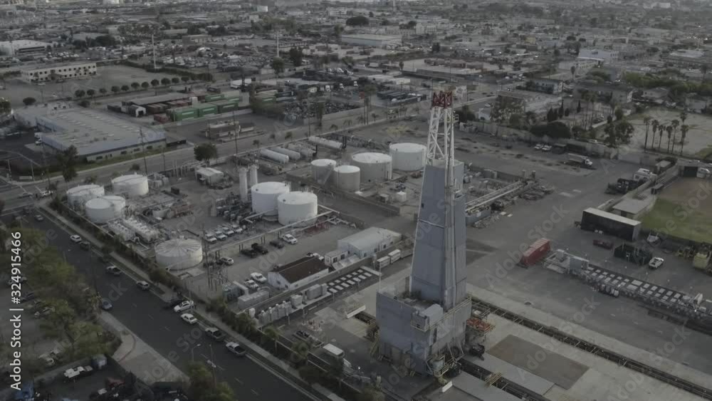 Panning aerial, tower in oil refinery in Los Angeles Panning aerial, tower in oil refinery in Los Angeles