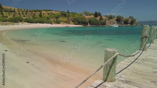 Looking out from a pier into a scenic bay, Slipper Island photo