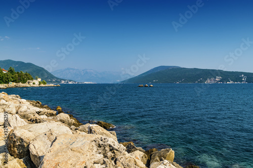 Sunny view of yacht in the Bay of Kotor near the town of Herceg Novi, Montenegro.