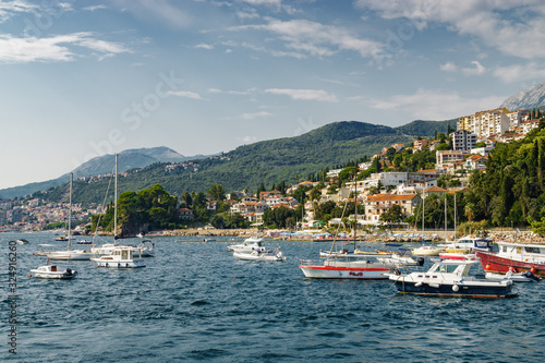 Sunny view of the Herceg Novi from the sea on the background of mountains  Montenegro.