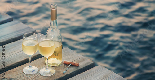 Wall Mural Drink wine by the sea. Selective focus.