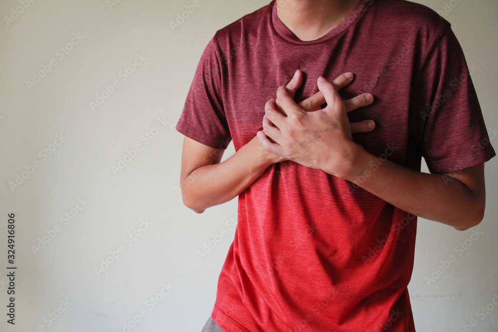 The man suffering from chest pain heart attack The man suffering from chest pain heart attack