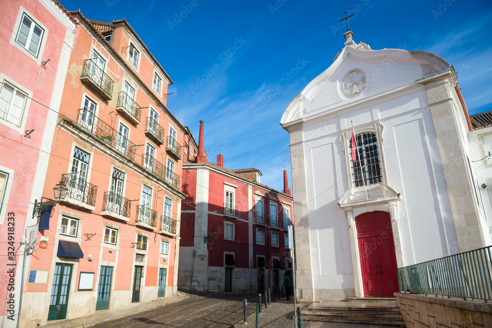 Obraz premium Early morning view of Santa Luzia church and colorful buildings in the hilly Alfama neighbourhood of Lisbon, Portugal