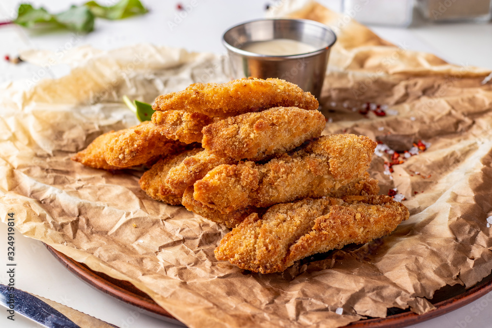 Chicken Nuggets Served on a Plate with White Sauce Chicken Nuggets Served on a Plate with White Sauce