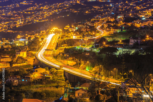 Aerial view of highway at night crossing the famous Funchal capital in Madeira island