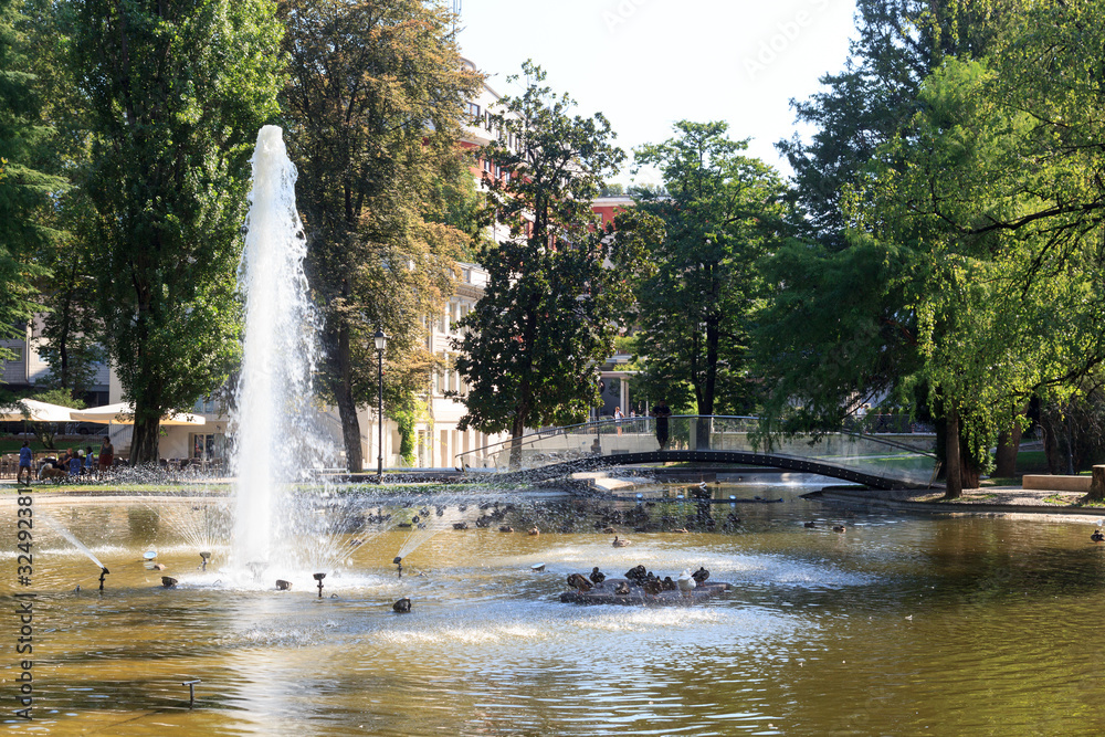 Fountain and bridge in park Giardini Pubblici in Trento, Italy Fountain and bridge in park Giardini Pubblici in Trento, Italy