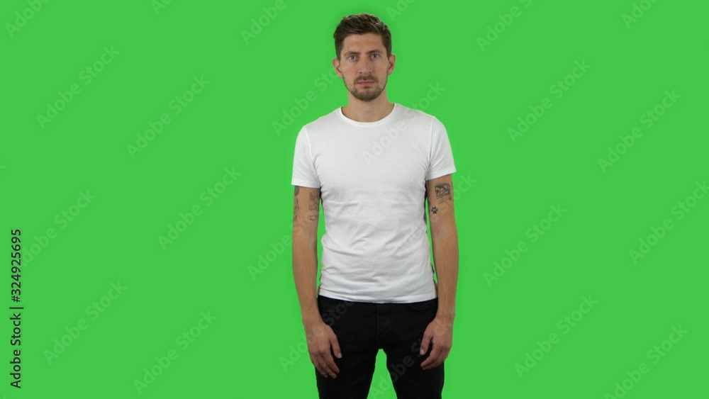 Confident guy is looking straight. Green screen Confident guy is looking straight. Green screen