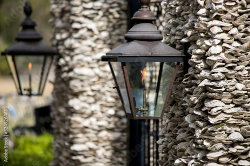 фотографія Architectural detail of gas lamps on oyster shell wall in South Carolina