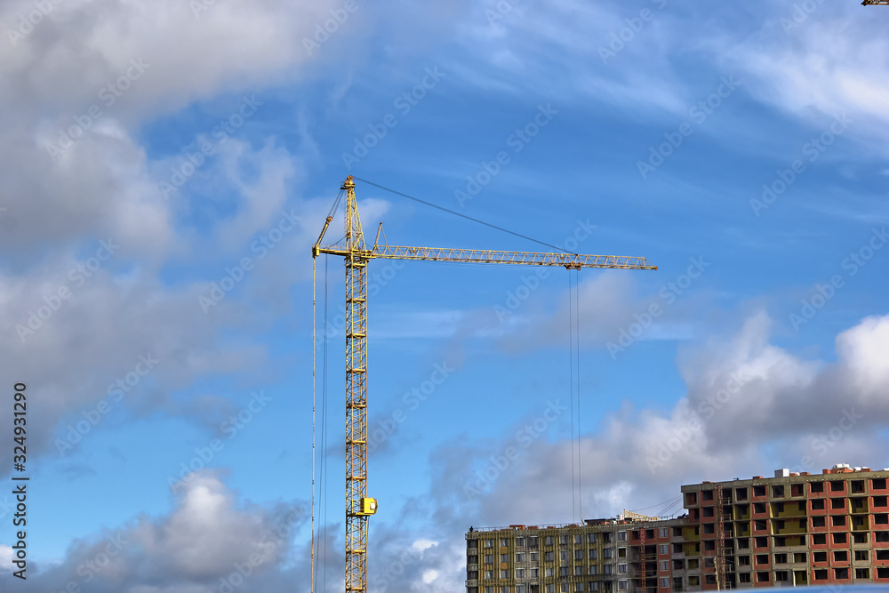 Industrial construction cranes the construction of an building Industrial construction cranes the construction of an building