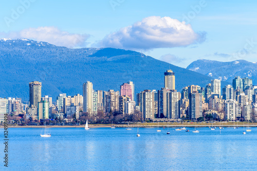 Fantastic view over ocean, yacht and snow mountains in Vancouver, Canada.