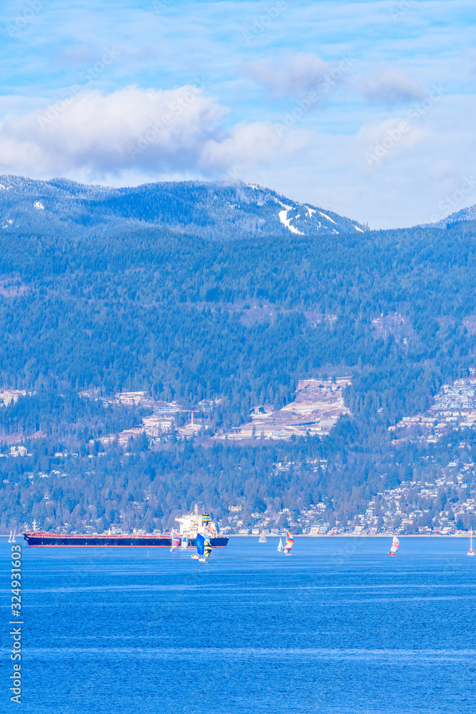Fantastic view over ocean, yacht and snow mountains in Vancouver, Canada. Fantastic view over ocean, yacht and snow mountains in Vancouver, Canada.