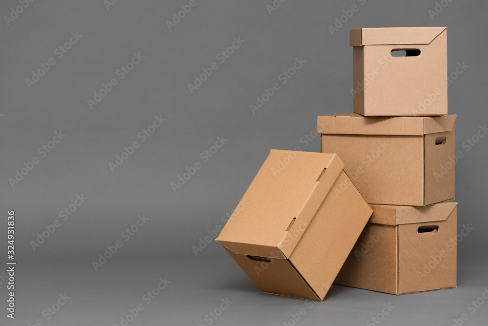 Cardboard box on gray background with copy space.