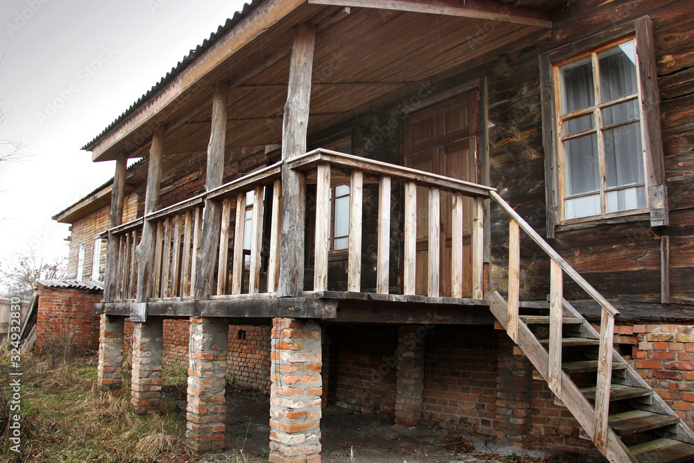 Old house in the village. Wooden steps Old house in the village. Wooden steps