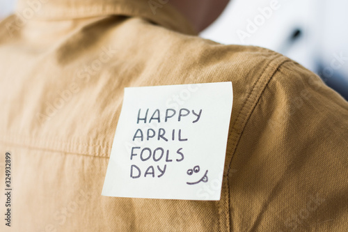 April 1 is day of fools.Funny day.April fish.Practical jokes.Inscriptions on the back.Stickers with jokes.Trick at work. Cheerful colleagues.Glued leaf on back.Colored stickers with inscriptions.