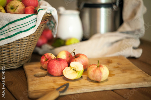 Apples on the table for a fresh juice making. Healthy nutrition concept.