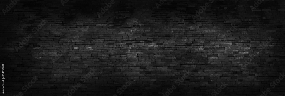 Panorama black brick walls that are not plastered background and texture. The texture of the brick is black. Background of empty brick basement wall.