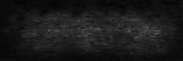 Panorama black brick walls that are not plastered background and texture. The texture of the brick is black. Background of empty brick basement wall.