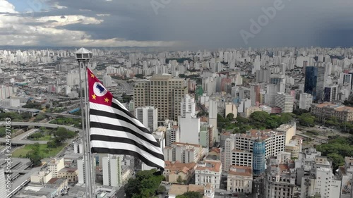 Drone shot city Sao Paulo Banespa building with city flag Sao Paulo  photo