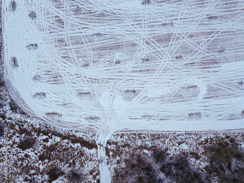 Russia, Moscow region, Aerial view of tire tracks on snow covered field