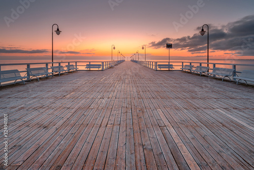 Fototapeta Naklejka Na Ścianę i Meble -  Sunrise at the pier in Orłowo in Gdynia
