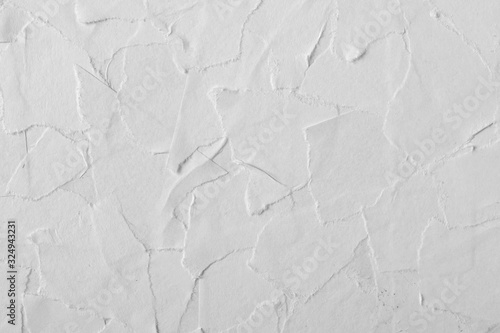 Glued pieces of white paper close-up. Texture for design.